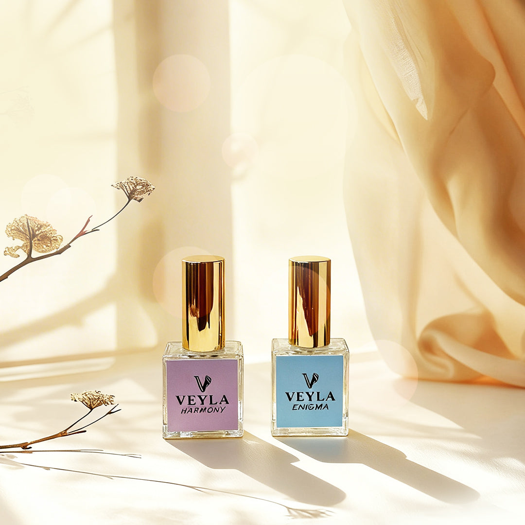 Two Veyla perfume bottles with 'Harmony' and 'Enigma' on a soft beige background.